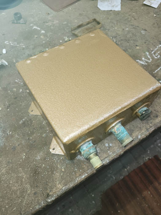 Flush tank painted in copper