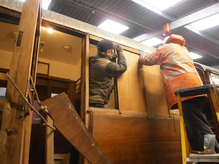 John and Graham fitting the cantrail moulding above the new panels
