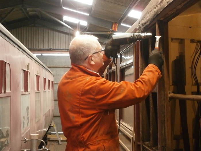 Jim P scrapes of more pink paint