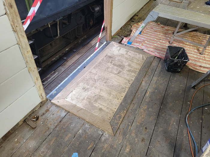 Load landing area just inside the cargo door